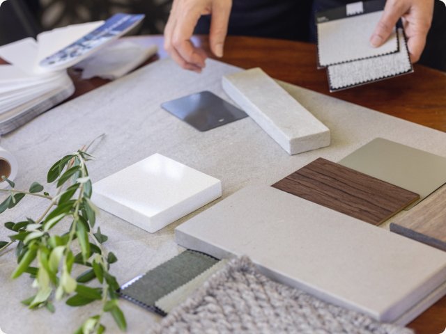 An designer's workspace featuring flooring samples 