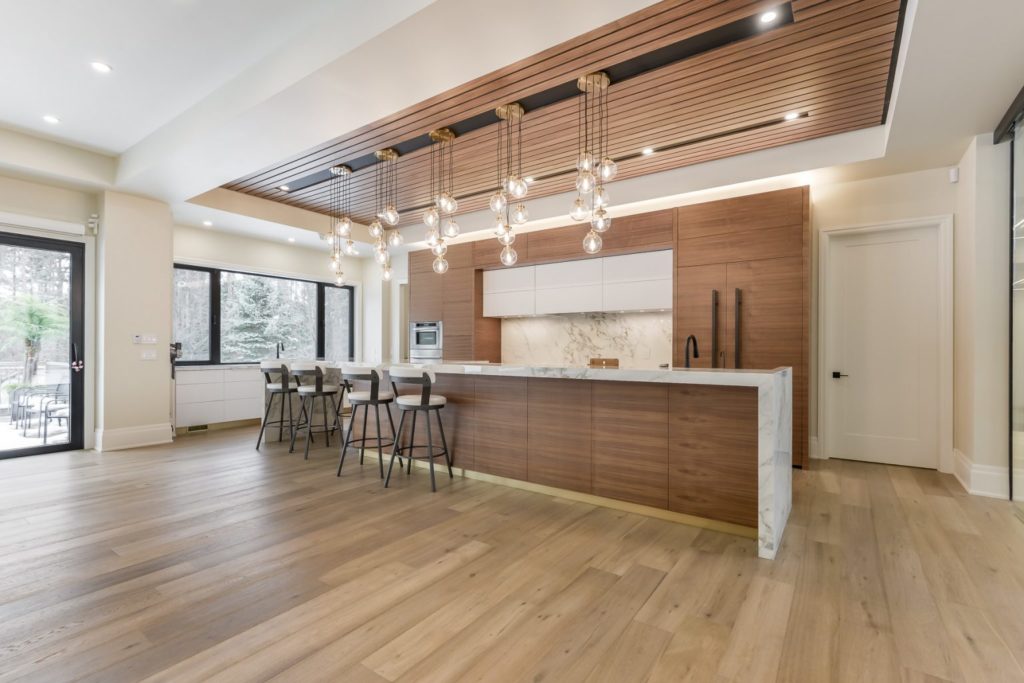 A modern and bright kitchen featuring Fuzion's Classical Elegance Hardwood flooring.